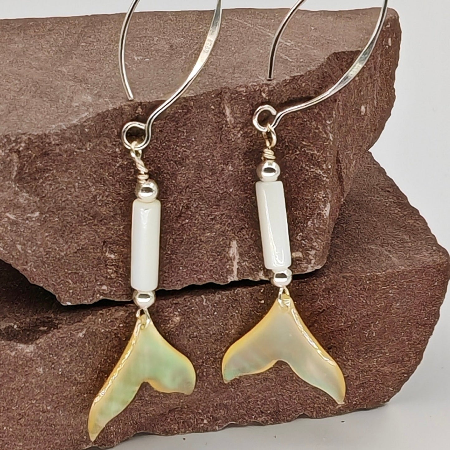 Whale tail shell dangle earring with natural carving and 925 sterling silver marquise V-wire