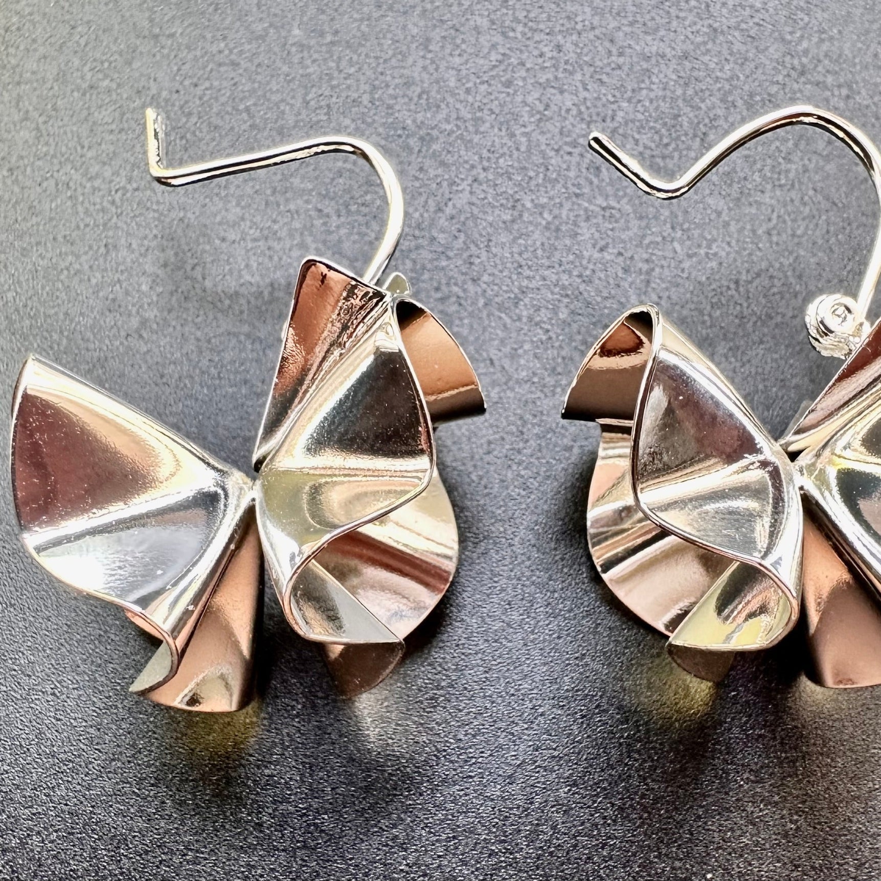 Close-up of petal-like curves and polished metal surface