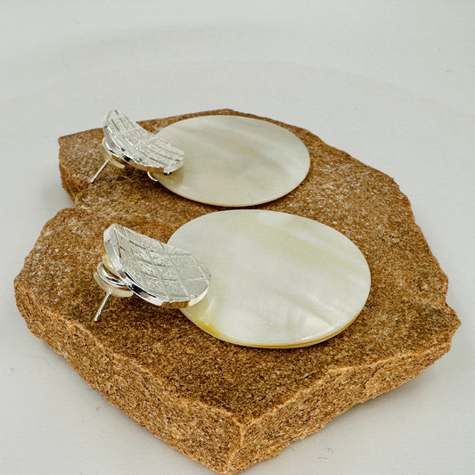 Side view showing depth and layering of shell and alloy discs