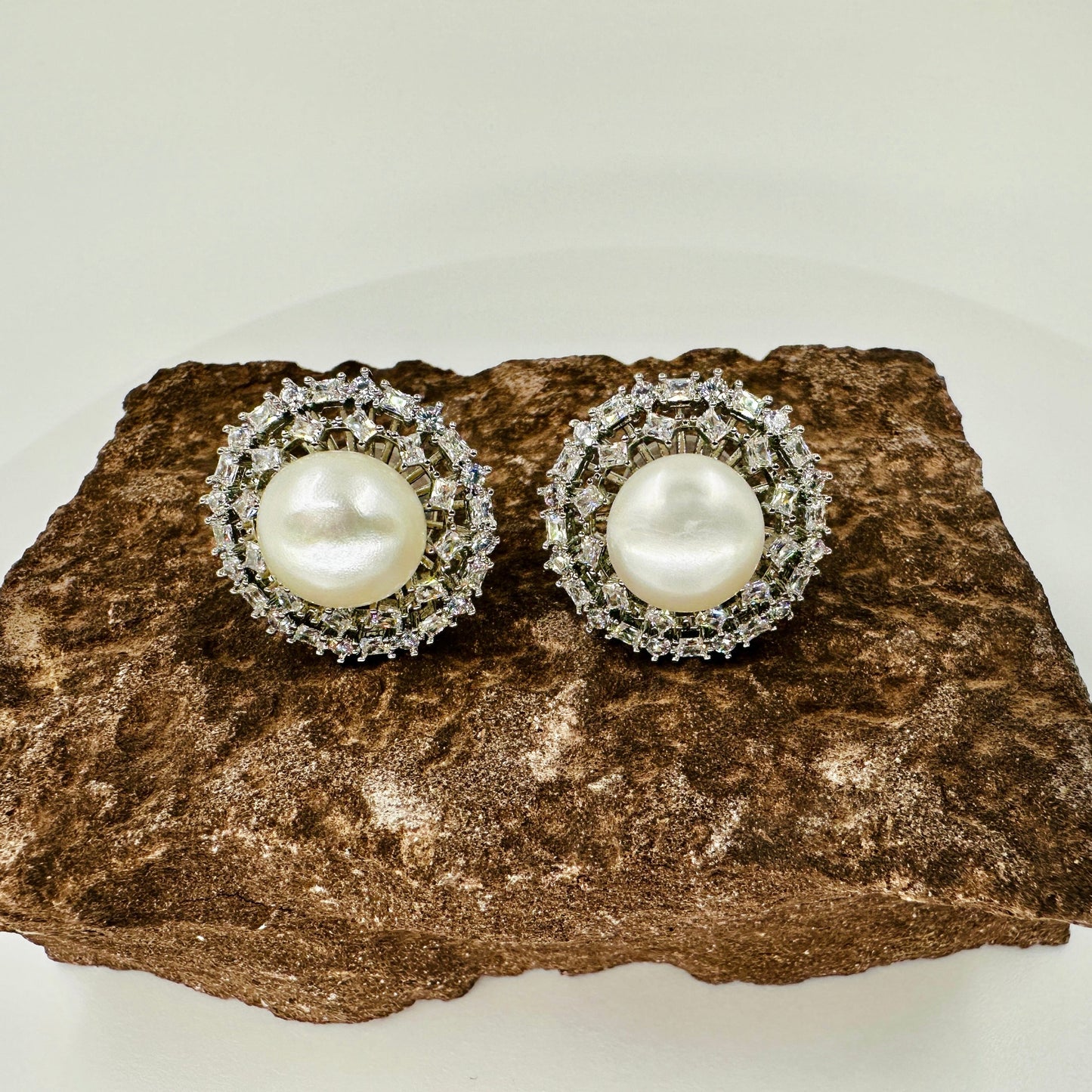 Floral freshwater pearl stud earrings with silver-tone lace setting and zirconia inlays