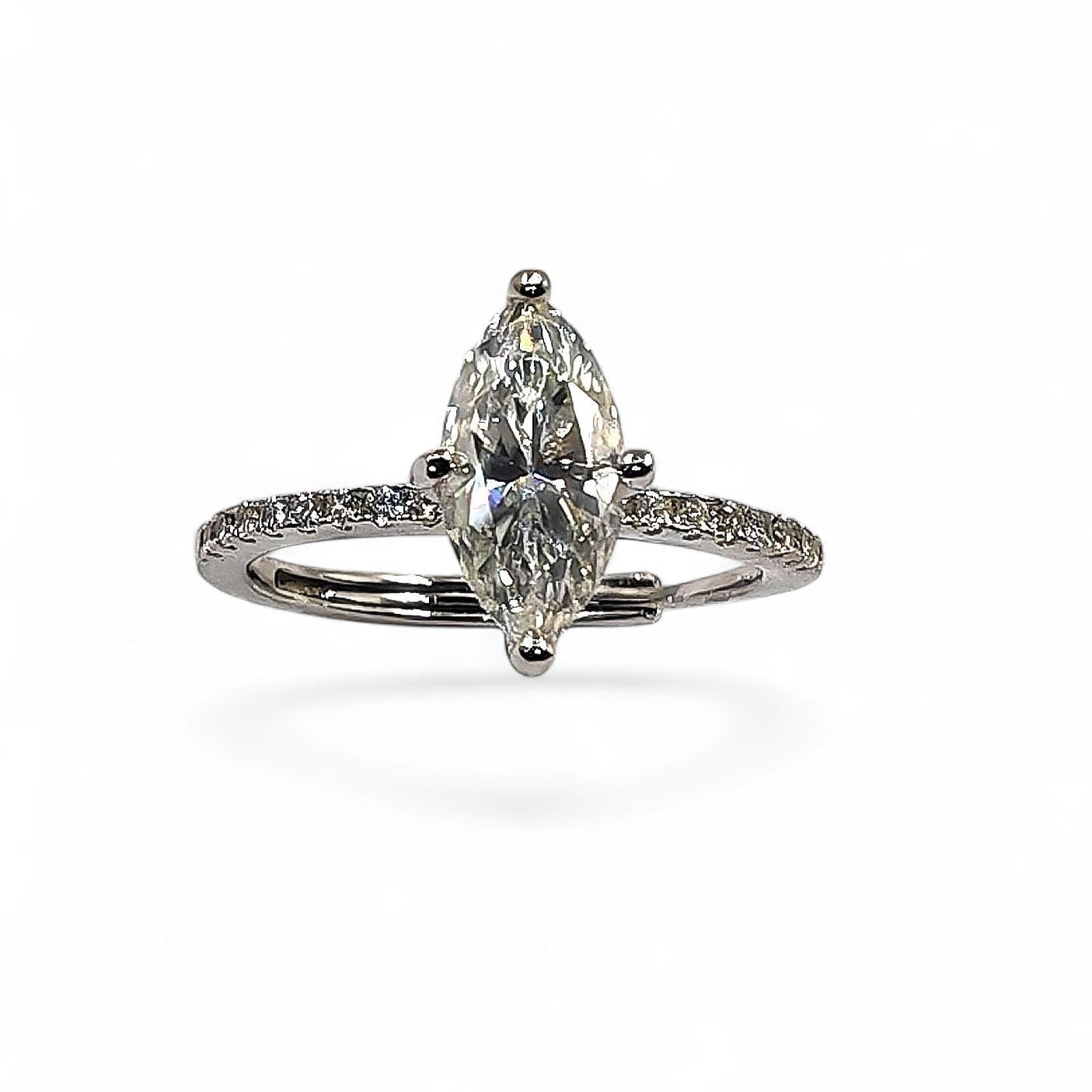 Close-up of marquise-cut moissanite and pavé halo