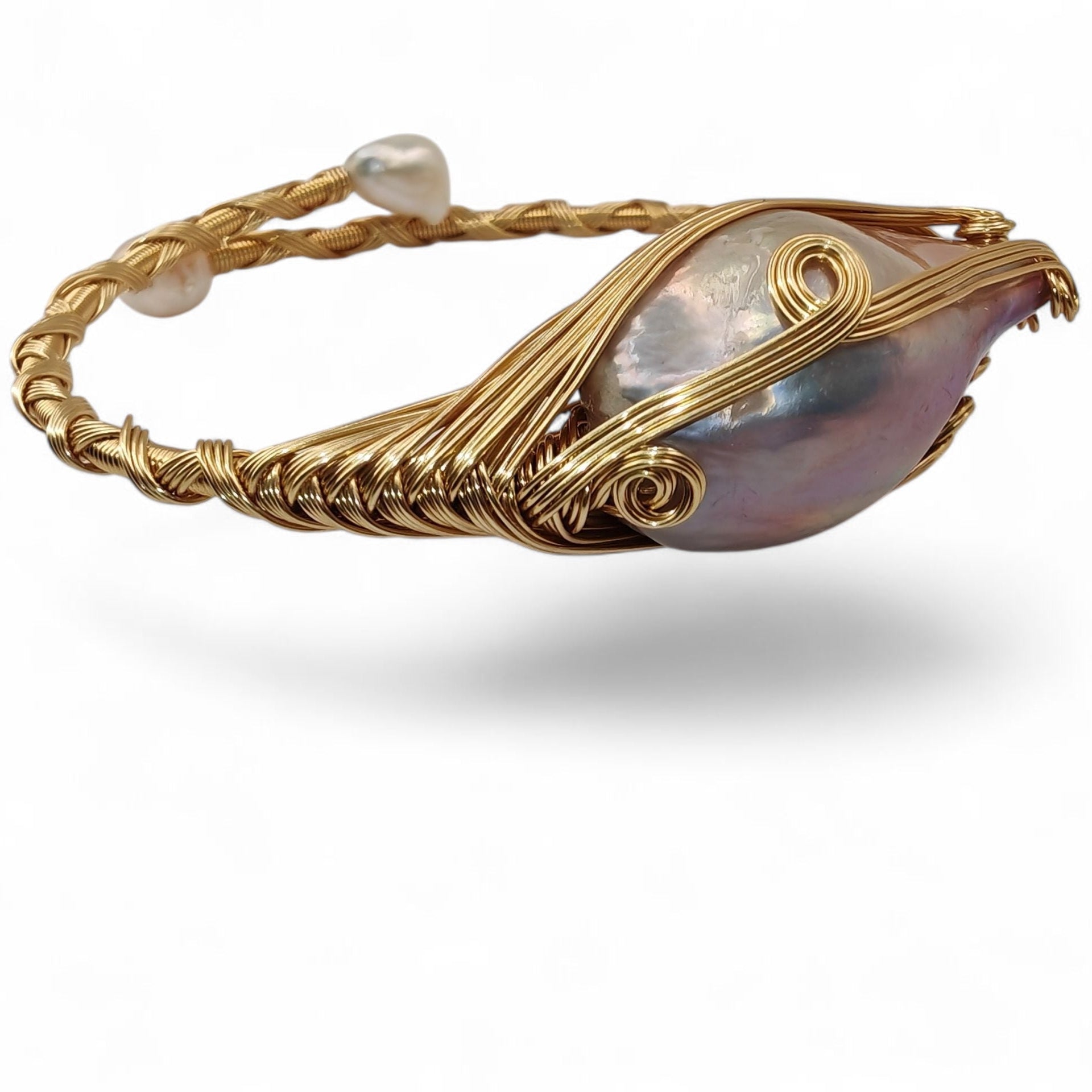 Side view of brass wire-wrapped bracelet showing depth and texture