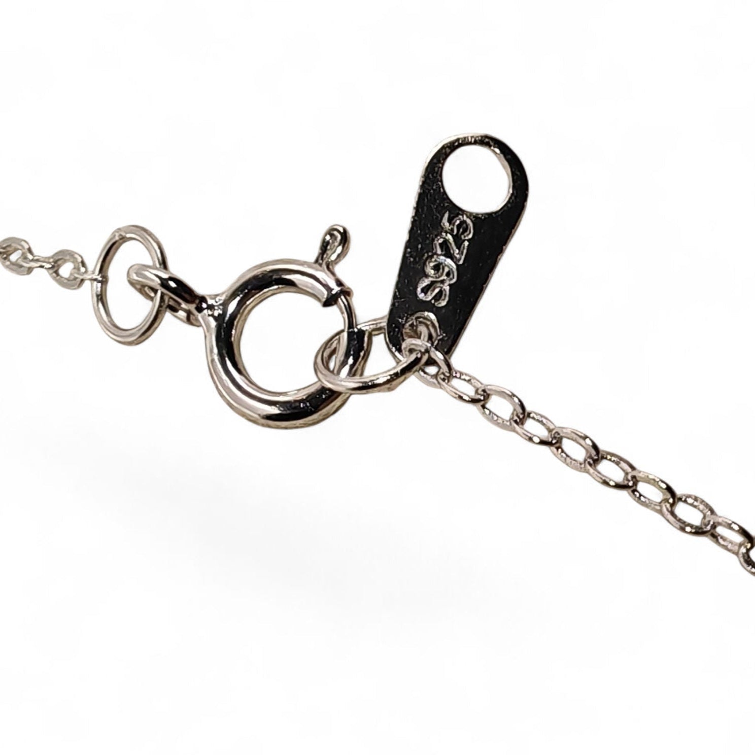 Close-up of a silver bracelet with clasp showing 925