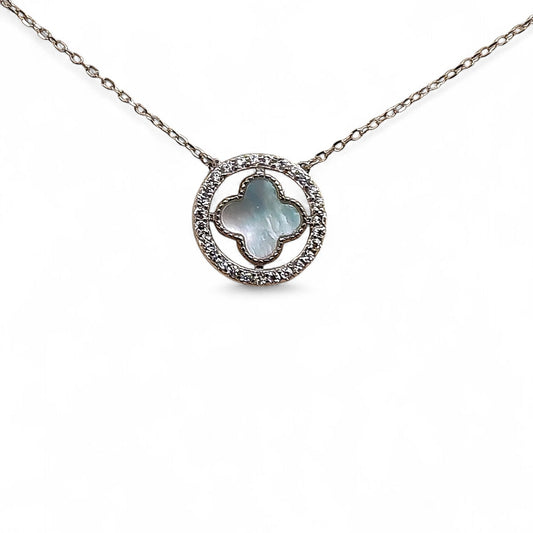 Close-up of cross pendant and zirconia halo