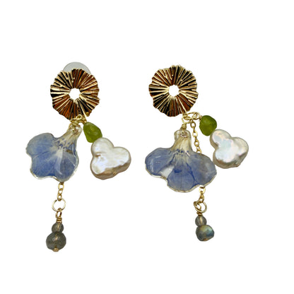 14k gold-plated dangle earrings with eternal flower, baroque clover pearl, olive quartz, and labradorite on beige background