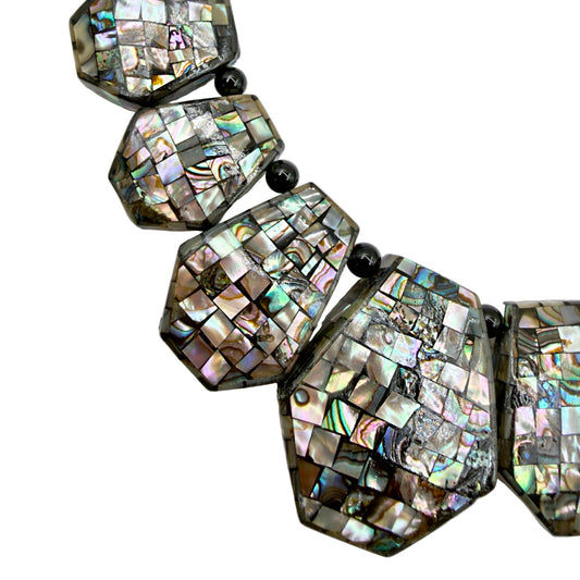 Close-up of abalone shell mosaic details
