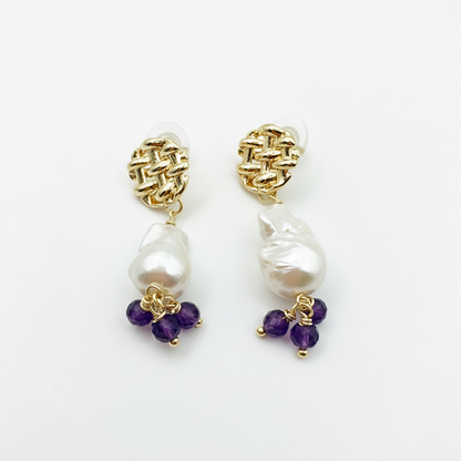 A pair of 43mm 14K gold-plated dangle earrings featuring large baroque pearls and small purple amethyst beads.