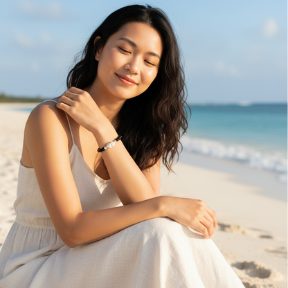 Close-up of the bracelet, highlighting the 6A grade obsidian beads and the large 18mm baroque pearl.