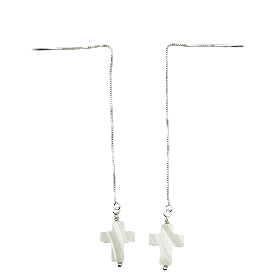 A pair of sterling silver dangle earrings featuring a 14mm white pearl cross pendant.