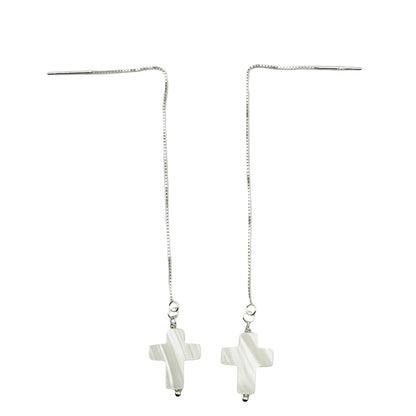 A pair of sterling silver dangle earrings featuring a 14mm white pearl cross pendant.