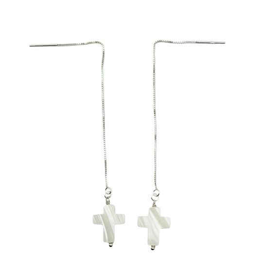 A pair of sterling silver dangle earrings featuring a 14mm white pearl cross pendant.