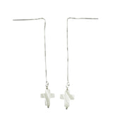 A pair of sterling silver dangle earrings featuring a 14mm white pearl cross pendant.