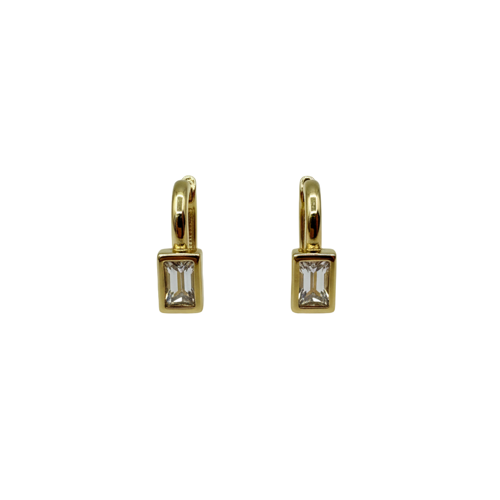Gold earrings with rectangular gemstones on a light gray background